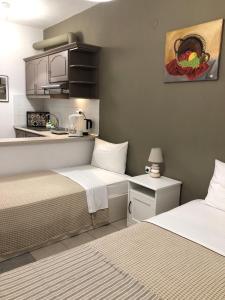 A bed or beds in a room at Aitherial Summer House