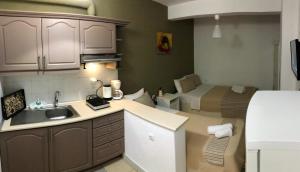 A kitchen or kitchenette at Aitherial Summer House