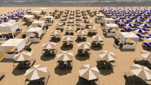 an overhead view of a beach with tables and umbrellas at Life Hotel 4 Superior in Bibione