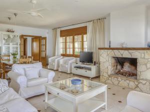 A seating area at Belvilla by OYO Villa in Arenys de Mar with Pool