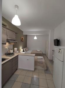 A kitchen or kitchenette at Aitherial Summer House