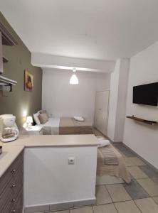A bed or beds in a room at Aitherial Summer House
