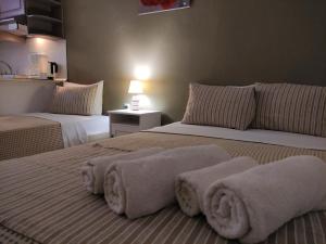 A bed or beds in a room at Aitherial Summer House