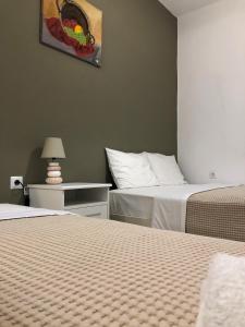 A bed or beds in a room at Aitherial Summer House