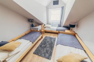 Posteľ alebo postele v izbe v ubytovaní Gościniec pod Lilijką