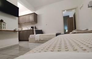 A bed or beds in a room at Aitherial Summer House