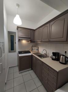 A kitchen or kitchenette at Aitherial Summer House