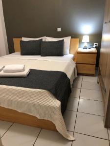 A bed or beds in a room at Aitherial Summer House