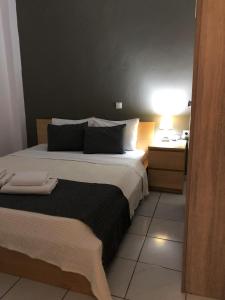 A bed or beds in a room at Aitherial Summer House