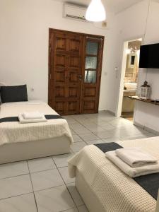 A bed or beds in a room at Aitherial Summer House