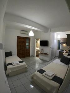 A bed or beds in a room at Aitherial Summer House