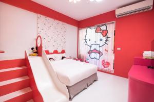 Postelja oz. postelje v sobi nastanitve Tong's Story Paternity B&B