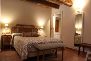 Postel nebo postele na pokoji v ubytování CASA RURAL LAS BODEGAS