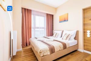 Posteľ alebo postele v izbe v ubytovaní Platan Tower Baltic & More Apartments