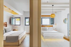 Postel nebo postele na pokoji v ubytování Andromeda Residences