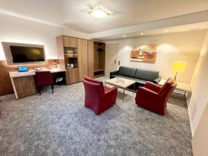 TV a/nebo společenská místnost v ubytování Hotel Merkur