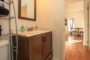 a bathroom with a sink and a mirror at Downtown Home with Grill 5 Mi to Garden of the Gods in Colorado Springs +21 photos