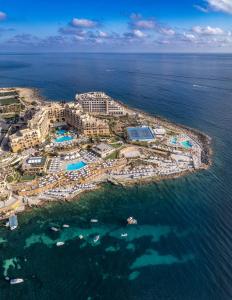 an aerial view of a resort in the ocean at Corinthia St George's Bay in St. Julianʼs