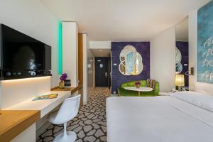Cama ou camas em um quarto em N’vY Manotel