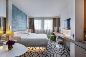 Cama ou camas em um quarto em N’vY Manotel