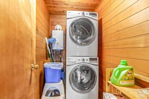 a washer and dryer in a tiny house at Cedar Chalet on Davos in Girdwood