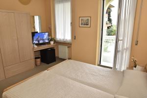 Ένα ή περισσότερα κρεβάτια σε δωμάτιο στο Hotel Terminus