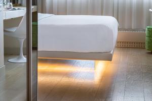 Cama ou camas em um quarto em N’vY Manotel