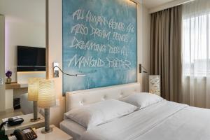 Cama ou camas em um quarto em N’vY Manotel