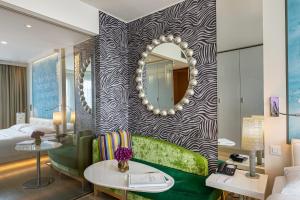 Cama ou camas em um quarto em N’vY Manotel