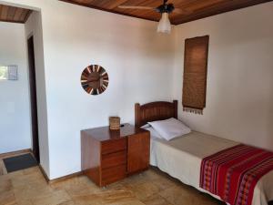 Cama ou camas em um quarto em Pousada Ikabana