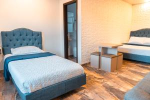 Postel nebo postele na pokoji v ubytování Hotel Salinero - Zipaquirá