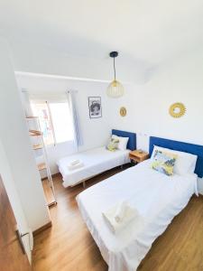 A bed or beds in a room at Apartamento Arenal II