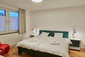 Кровать или кровати в номере Gemütliche Wohnung mit Balkon