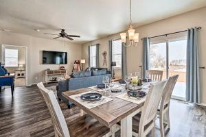 a dining room and living room with a table and chairs at Dreamy Windsor Home with Grill about 3 Miles to Lake! in Windsor