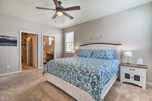 a bedroom with a bed and a ceiling fan at Dreamy Windsor Home with Grill about 3 Miles to Lake! in Windsor