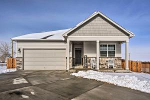 a white house with a garage at Dreamy Windsor Home with Grill about 3 Miles to Lake! in Windsor