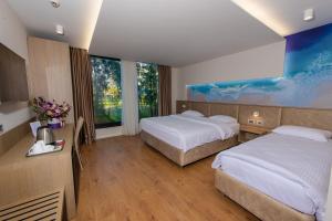 Postel nebo postele na pokoji v ubytování Marina Premium Hotel & Apartments
