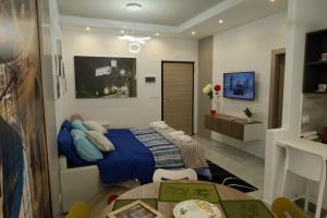 a bedroom with a bed and a table in it at B&B Acquedotto in Corigliano Calabro