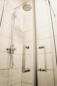 a shower in a bathroom with a glass door at The Swan Hotel in Newport +15 photos