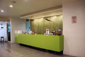 a store with a green counter in a building at Aranzazu Eco in Guadalajara +14 photos