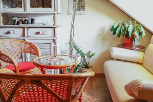 a living room with chairs and a table and a couch at Mníchov dvor in Slovenská ľupča