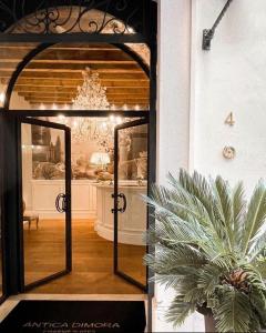 an open door to a room with a potted plant at Antica Dimora Desenzano in Desenzano del Garda