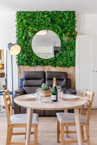 a living room with a table and a couch at Aurora Lov'Room Proche de Saint Charles in Marseille