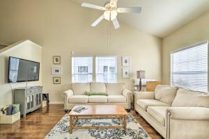 a living room with two couches and a ceiling fan at Walk to Lake Family Gem with Pool Access in Afton in Afton