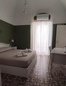 Posteľ alebo postele v izbe v ubytovaní Dimora della Nonna-Luxury Home + 28 fotografií