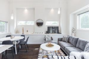 a living room with a couch and a table at West Coast Luxury Living in Vancouver