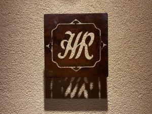 a sign with the word mt on a wall at Hotel Roma in Bologna