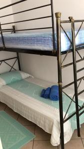 a bunk bed in a room with two bunk beds at CAMY Apartment Scopri Tortolì Appartamento Centrale vicino alle Spiagge! in Tortolì
