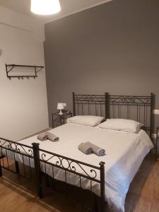 a bedroom with a large bed with two pillows on it at Marco E Laura B&B in Rome