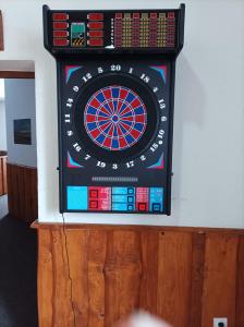 a dart board on the wall of a room at Penzion a restaurace U Maryny in Bocanovice